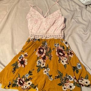 Cross straps in back, flowy top yellow and pink floral